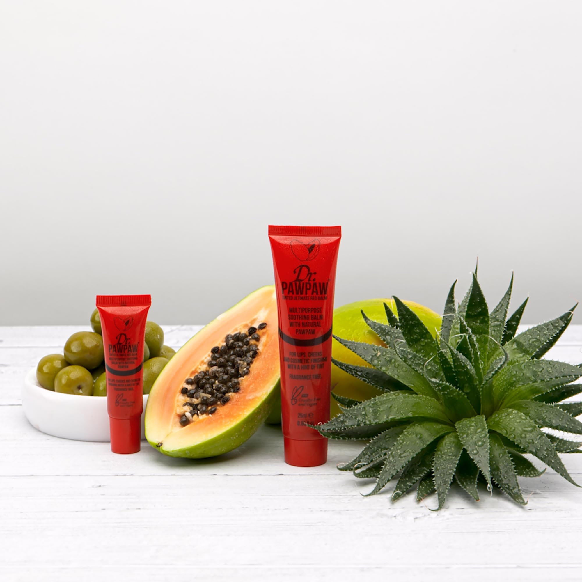 Dr. PAWPAW ORIGINAL BALM held in hand showing size and travel-friendly convenience