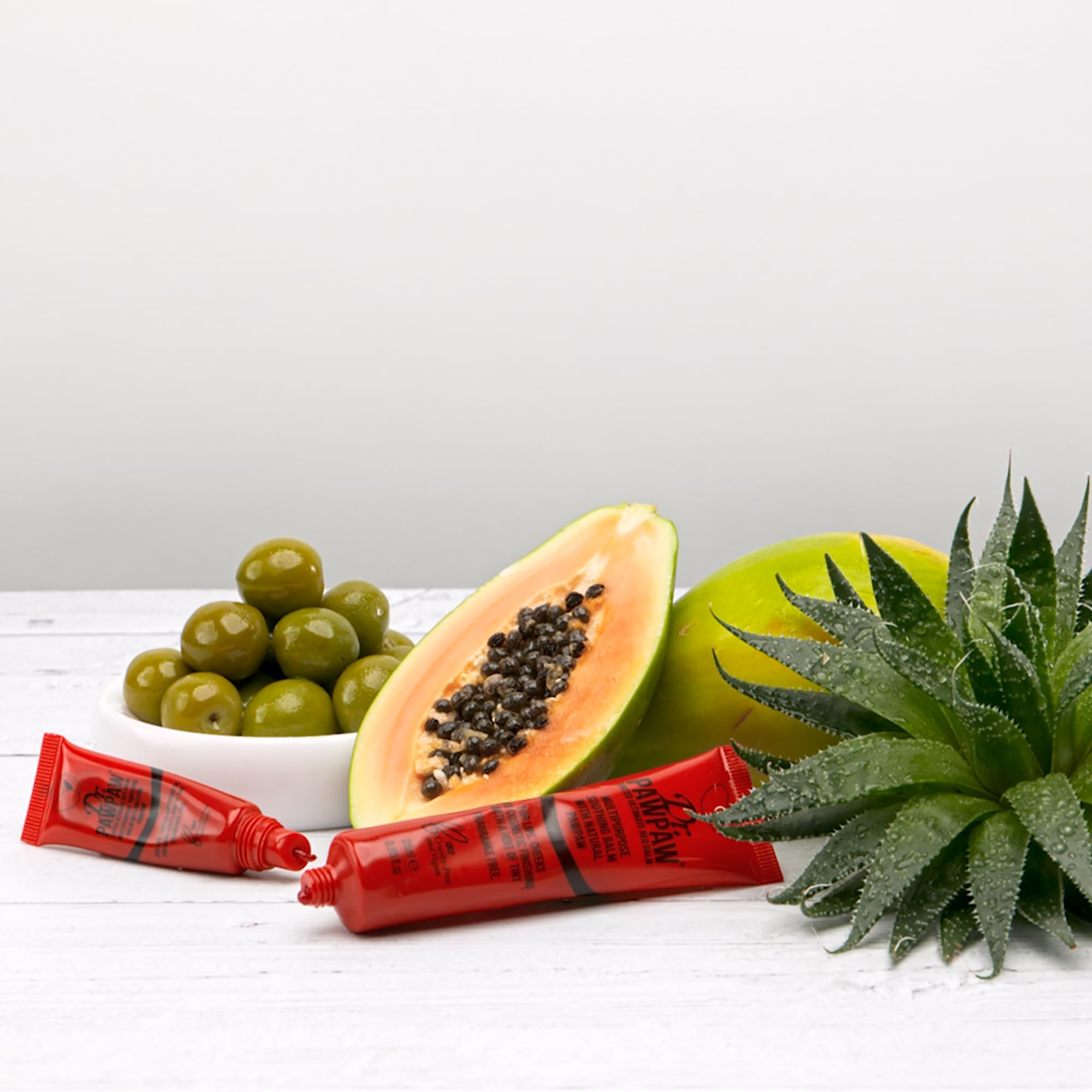 Dr. PAWPAW ORIGINAL BALM ingredient close-up with pawpaw and aloe highlighting soothing benefits