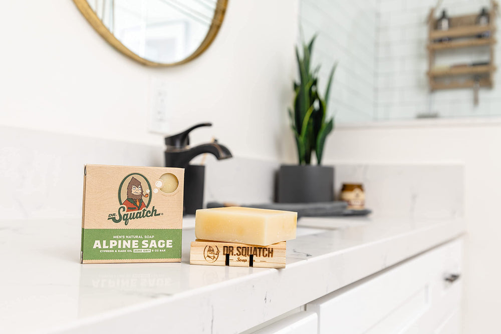 Dr. Squatch lathering Alpine Sage in hand for easy, moisturizing cleanse