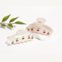 Drealoe cherry clips in picnic lifestyle scene enhancing casual outfit charm