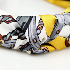 DRESHOW cross knot detail highlighting decorative knot and secure fit benefit