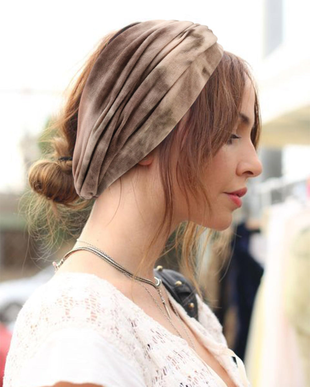 DRESHOW headband worn at forehead showing secure hold and style