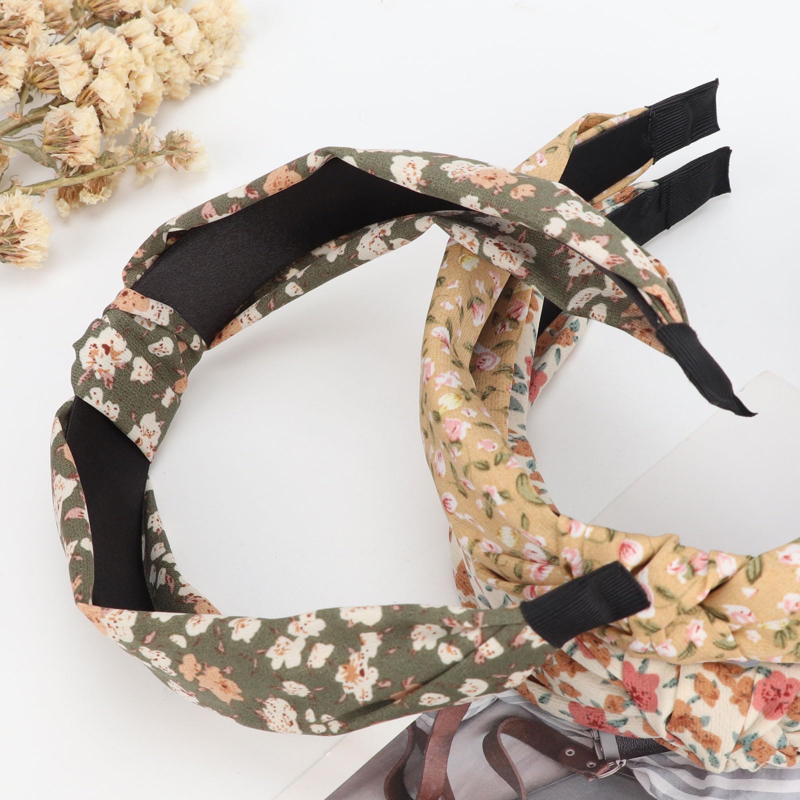 DRESHOW headband next to hand for scale showing compact, lightweight design
