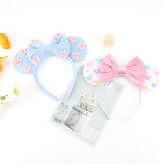 Two DRESHOW headbands styled on table as a ready-to-gift two-pack