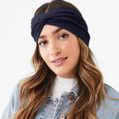 DRESHOW headband worn with ponytail demonstrating secure hold during activity