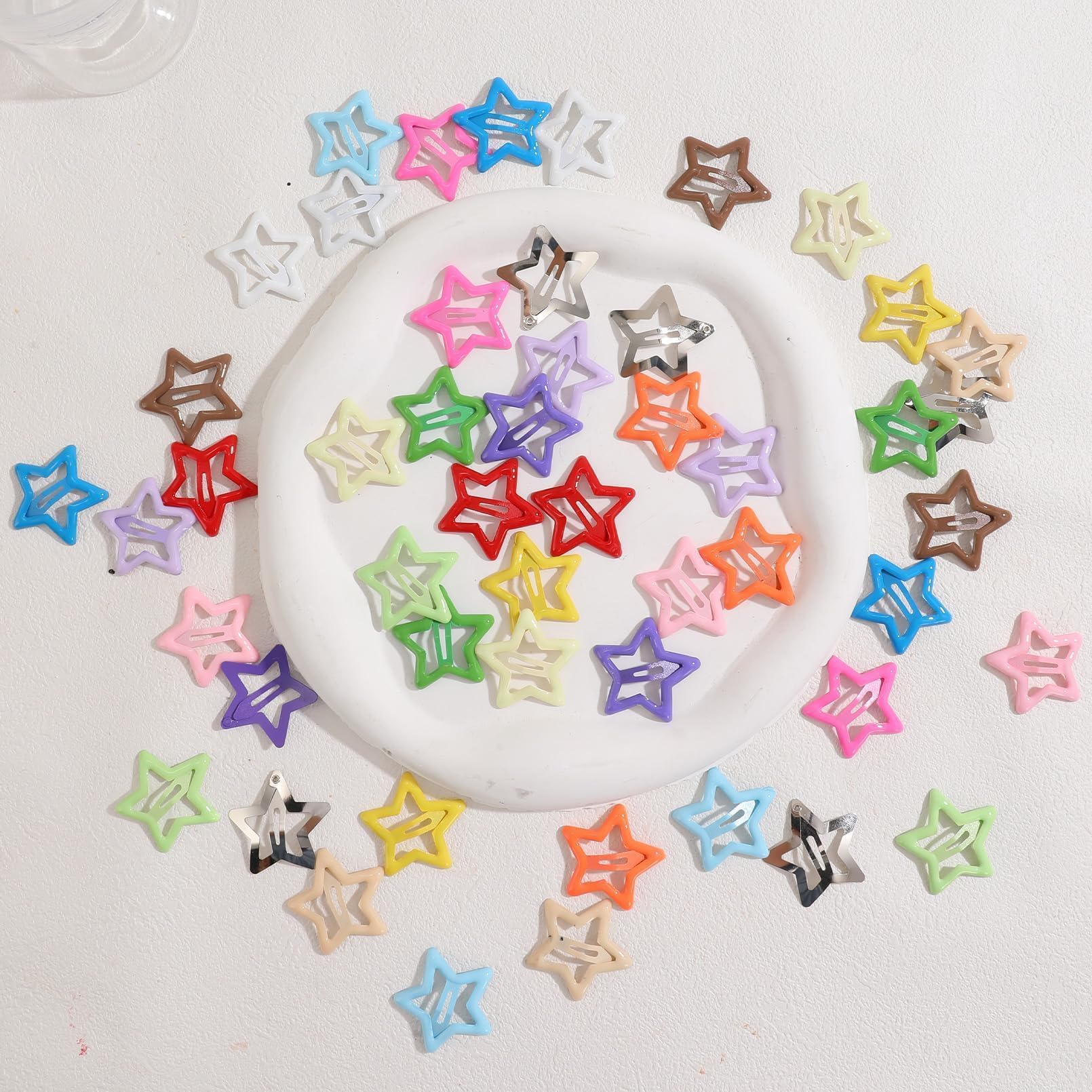 Drnytunk spread of multicolor star clips showing variety