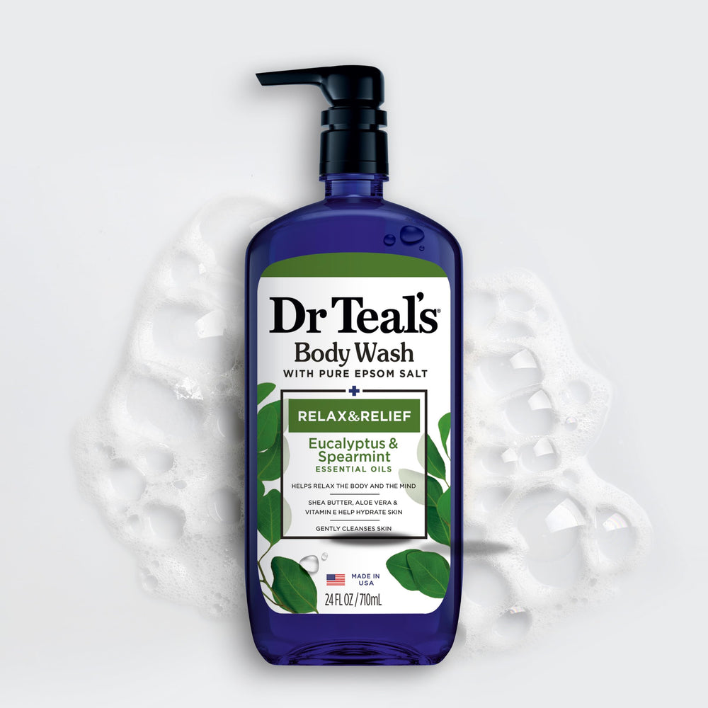 Dr Teal's bottle in hand size comparison illustrating 24 fl oz scale