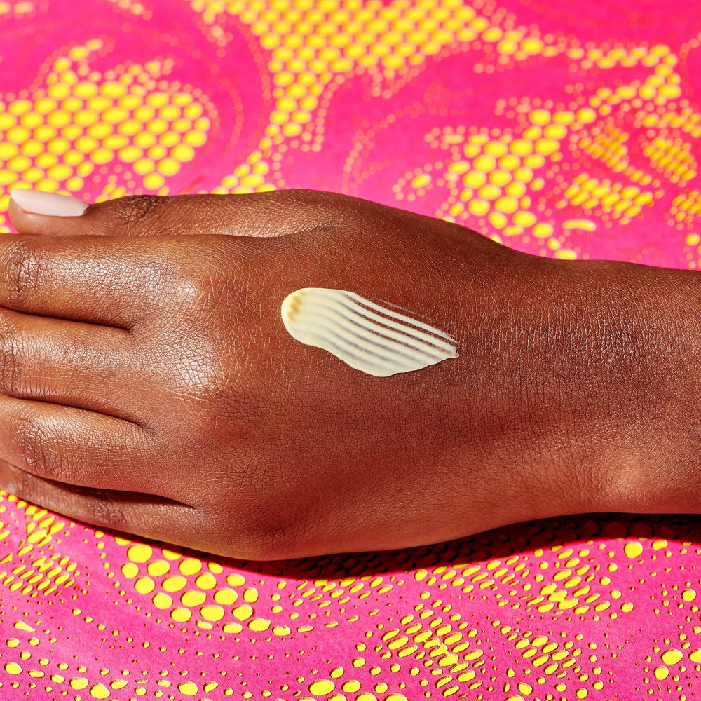 Drunk Elephant product on hand being applied for smoother, renewed skin