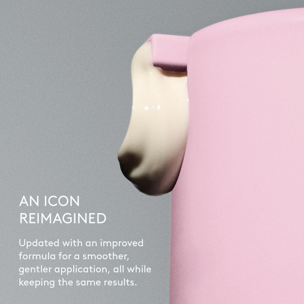 Drunk Elephant jar beside a coin for scale highlighting compact travel-friendly size