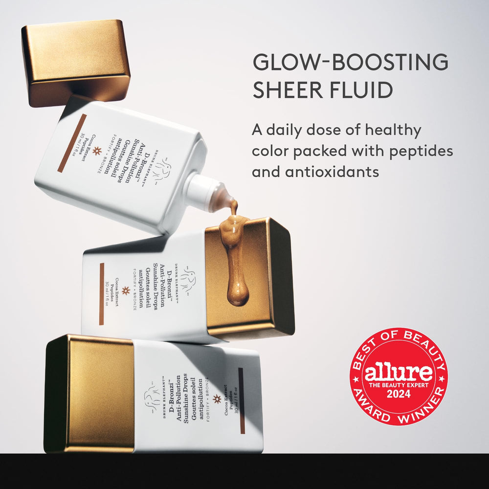 Drunk Elephant dropper releasing a single drop for precise, buildable bronzing control