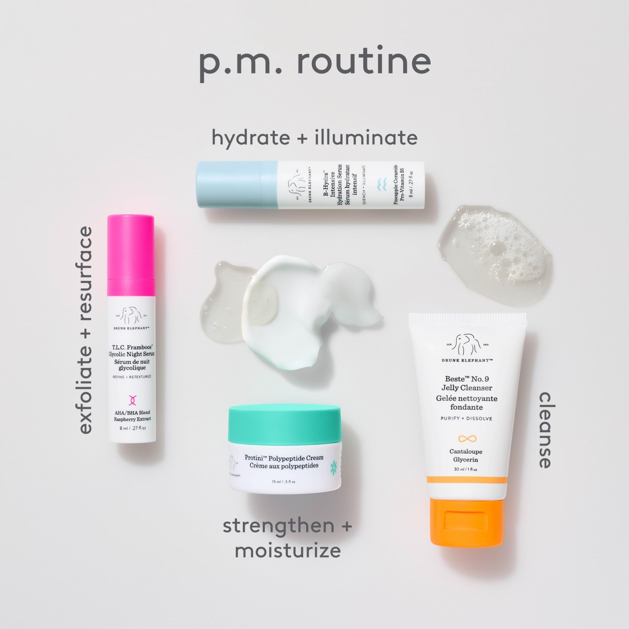 Drunk Elephant Littles kit in a toiletry bag on travel table showing portability and routine ease