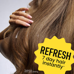 Drybar Detox spray action mid-air illustrating even mist for oil absorption and lift