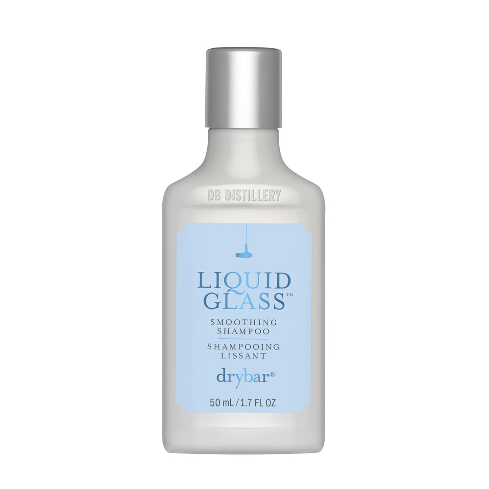 Drybar travel bottle front view showing branding and compact size benefit