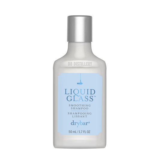 Drybar travel bottle front view showing branding and compact size benefit