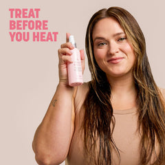 Drybar bottle placed beside brush showing improved styling slip benefit
