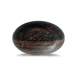 Dudu-Osun soap in hand creating foam, demonstrates easy lather and gentle cleansing benefit