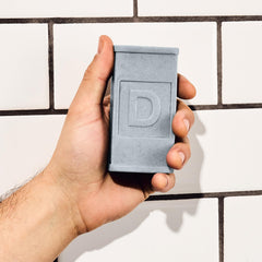Soap bar on shower shelf in lifestyle scene, Duke Cannon keeps routine refreshed