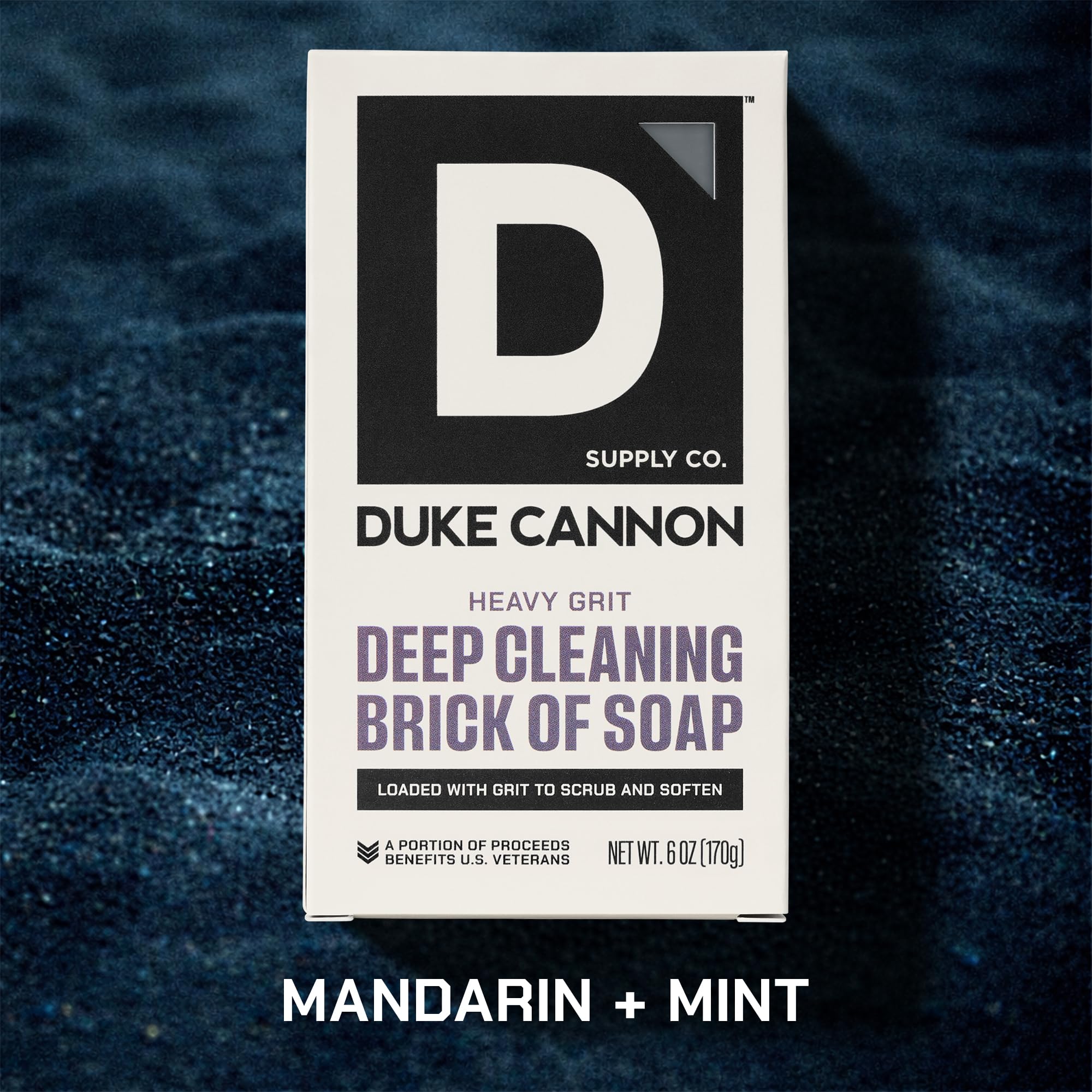 Duke Cannon brick soap next to a ruler, shows durable 6 oz size benefit