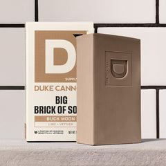 Duke Cannon Supply Co. soap styled outdoors evoking rugged lime and vetiver scent benefit