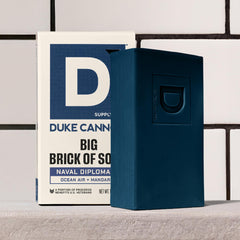Duke Cannon bar resting on dry dish to extend lifespan between uses