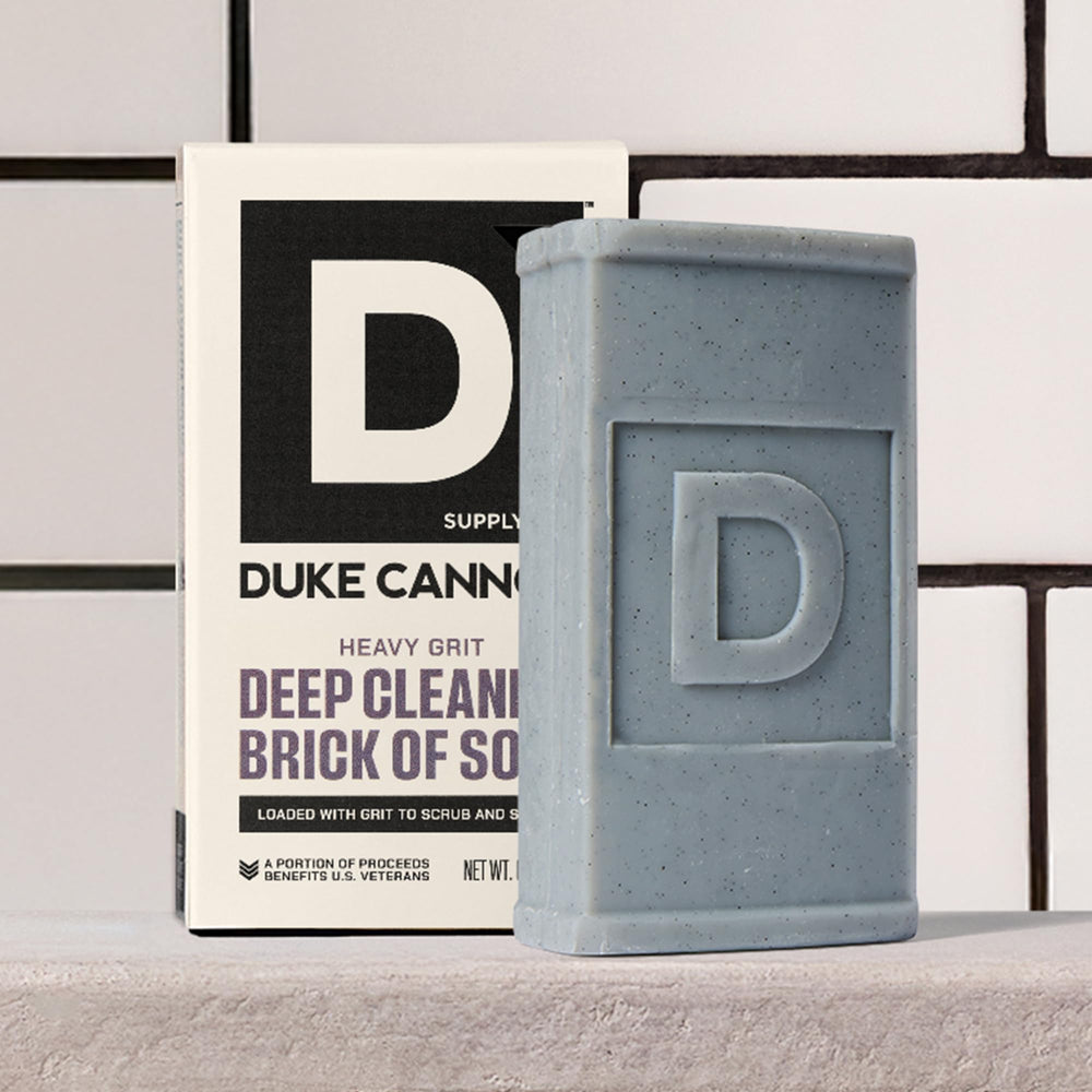 Label close-up showing aloe and shea on Duke Cannon bar, supports skin hydration