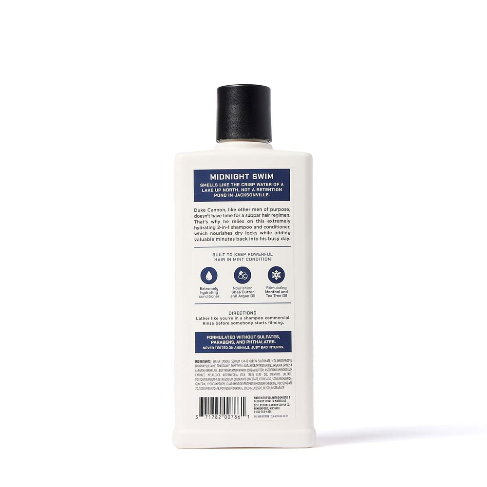 Duke Cannon bottle next to ruler showing 14 fl oz size and travel convenience