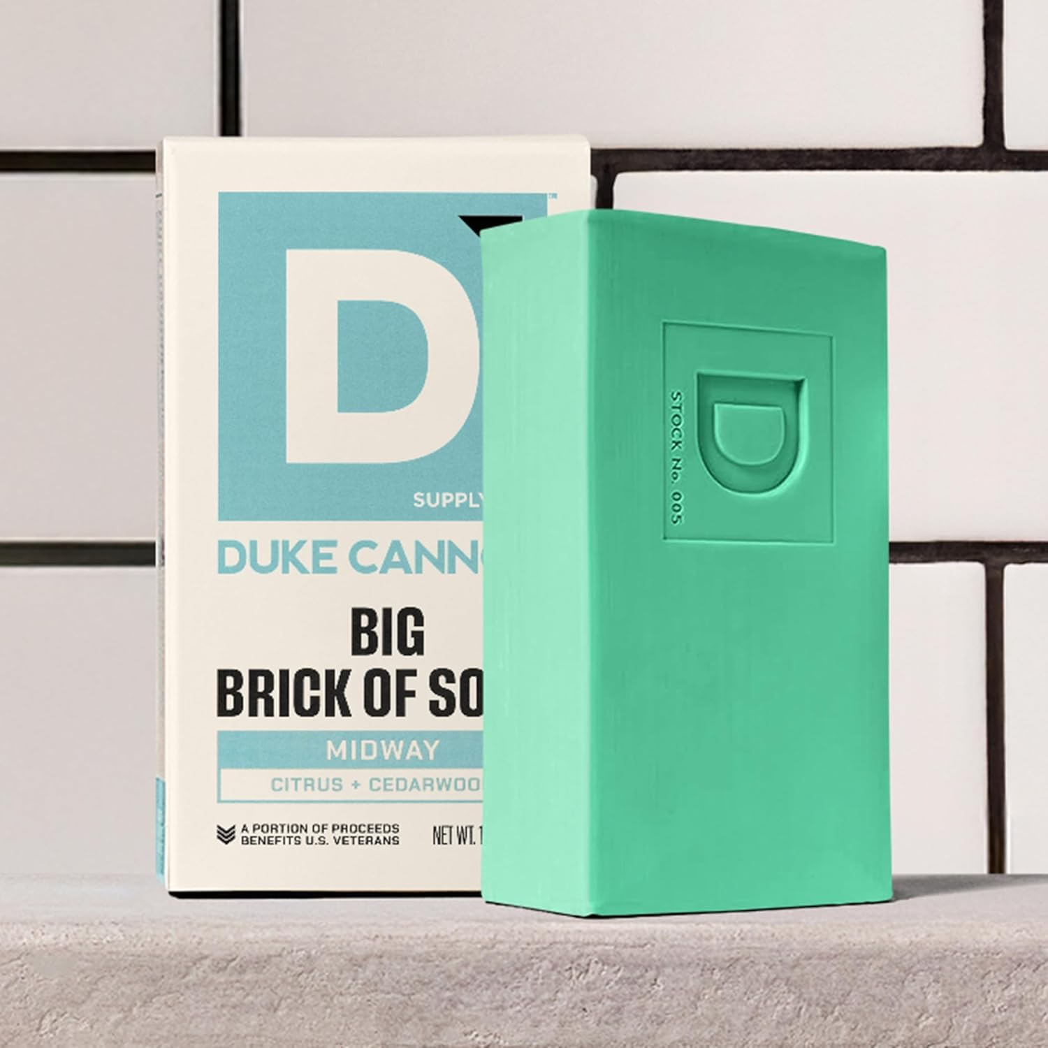 Duke Cannon Midway held in hand for scale, illustrates sizable bar and practical handling