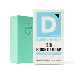 Duke Cannon Midway in shower creating suds on loofah, shows invigorating daily use benefit