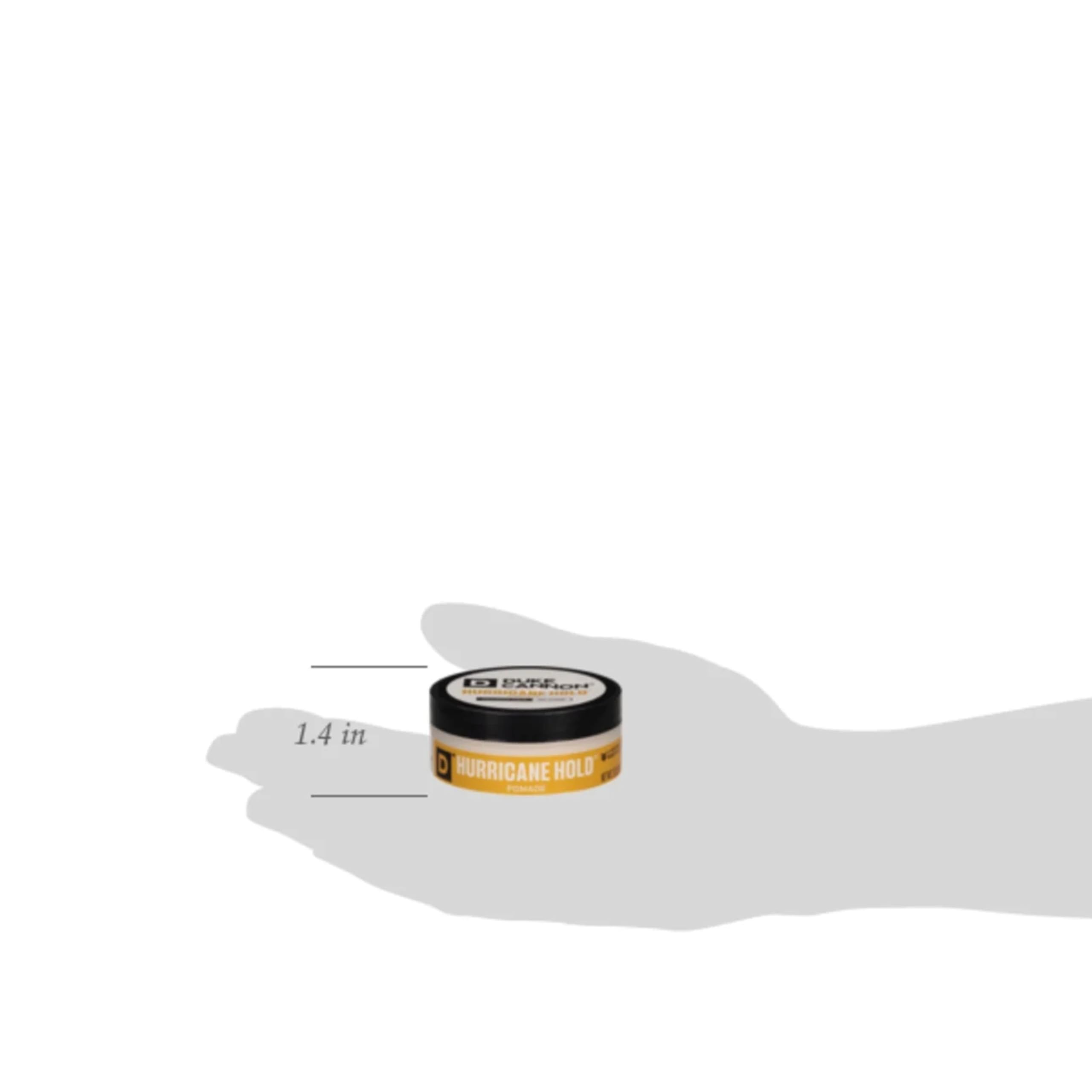 2 oz Duke Cannon pomade next to travel items illustrating compact, travel-friendly size