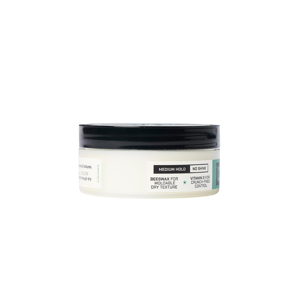 Putty beside everyday items illustrating Duke Cannon travel-ready size