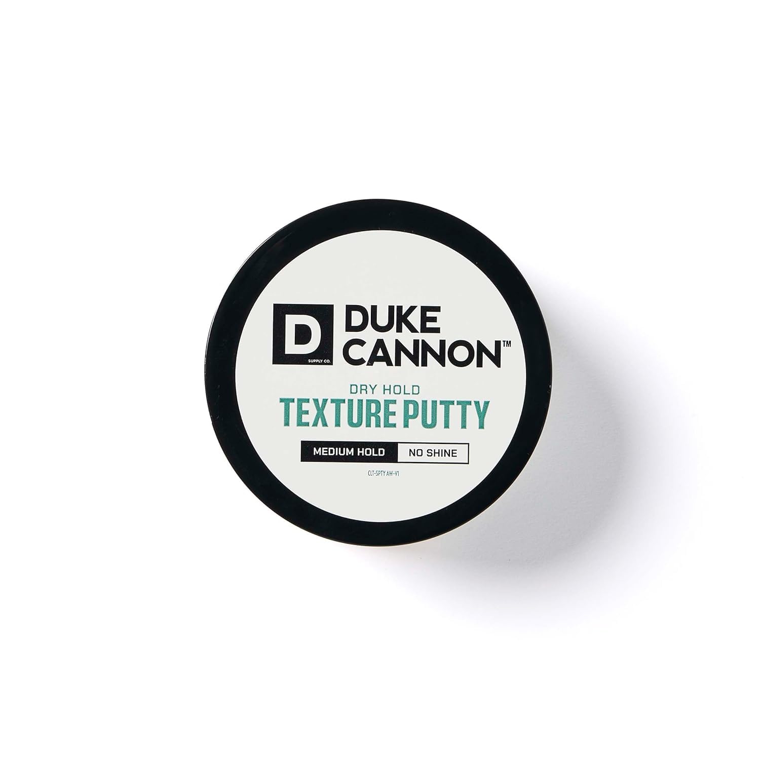 Model with styled hair using Duke Cannon putty showing natural matte hold