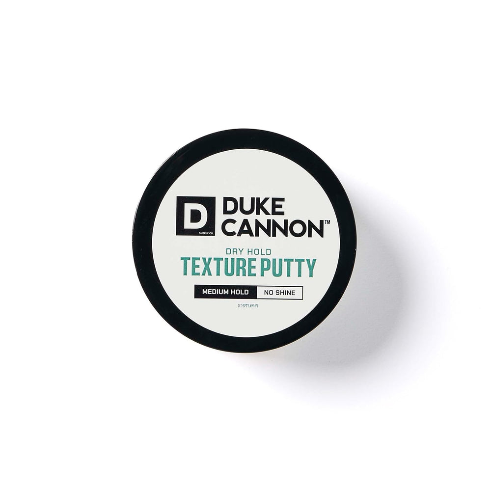 Model with styled hair using Duke Cannon putty showing natural matte hold