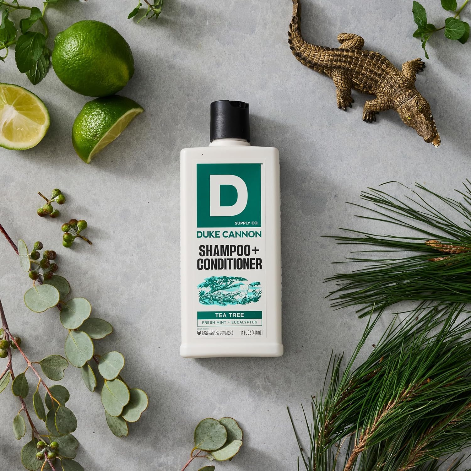 Duke Cannon bottle held in shower illustrating invigorating menthol cool