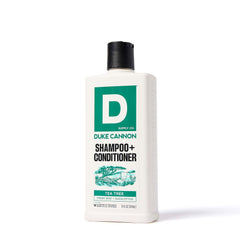 Duke Cannon bottle in hand to show 14 fl oz scale and portability
