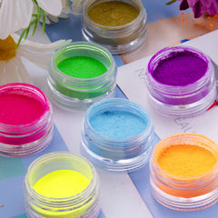Duufin pigment being rubbed into cured gel nail demonstrating smooth metallic finish