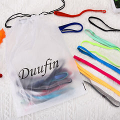 Duufin band stretched next to ruler illustrates size range and secure fit benefit