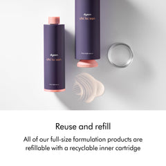 Dyson refill cartridge next to bottle, illustrating refillable full-size system