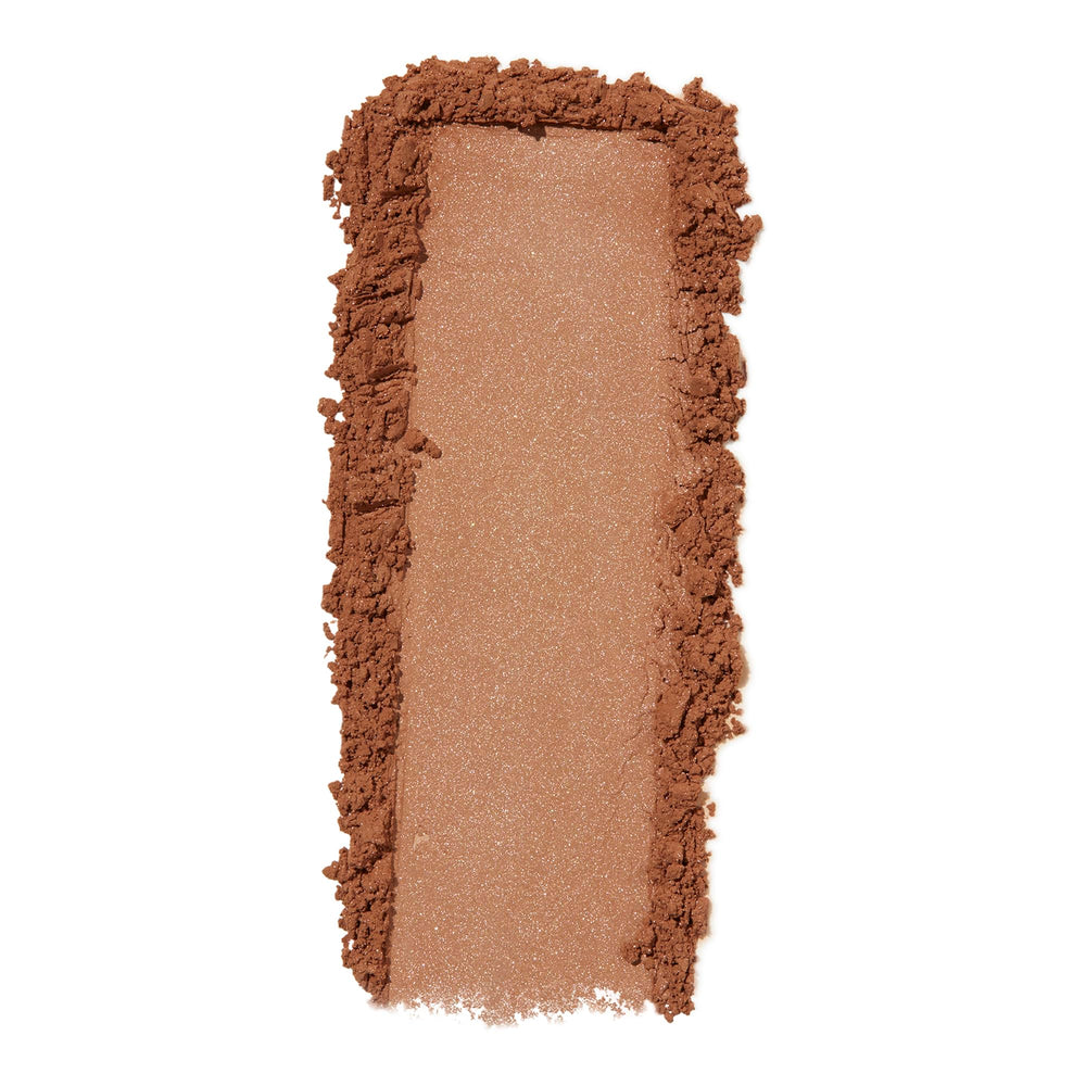 e.l.f. Halo Glow loose powder texture close-up showing silky particles and blur effect