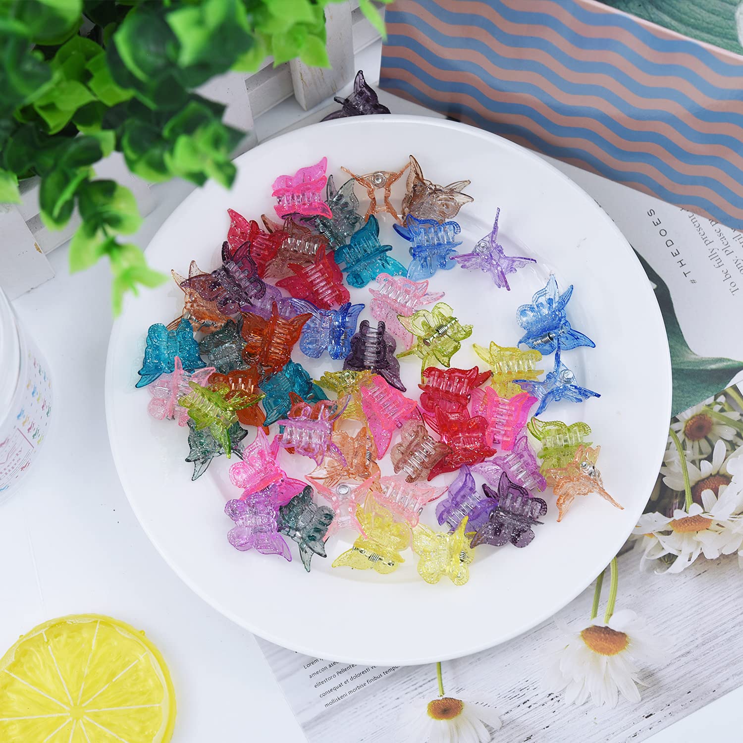 EAONE assortment of butterfly clips in a flatlay styled with accessories for playful outfit coordination