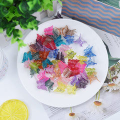EAONE assortment of butterfly clips in a flatlay styled with accessories for playful outfit coordination
