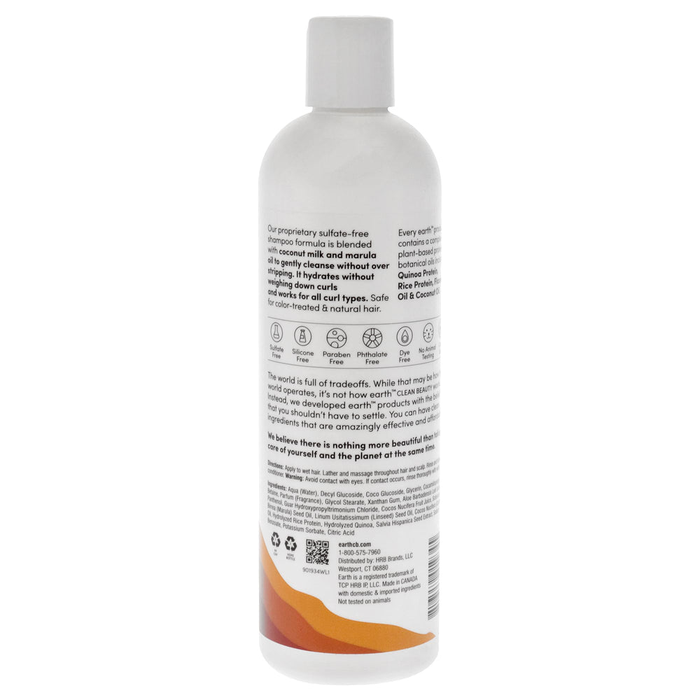 earth shampoo bottle next to towel showing salon-quality results