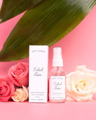 Earth Harbor bottle with rose petals in lifestyle shot conveying calming ritual benefits