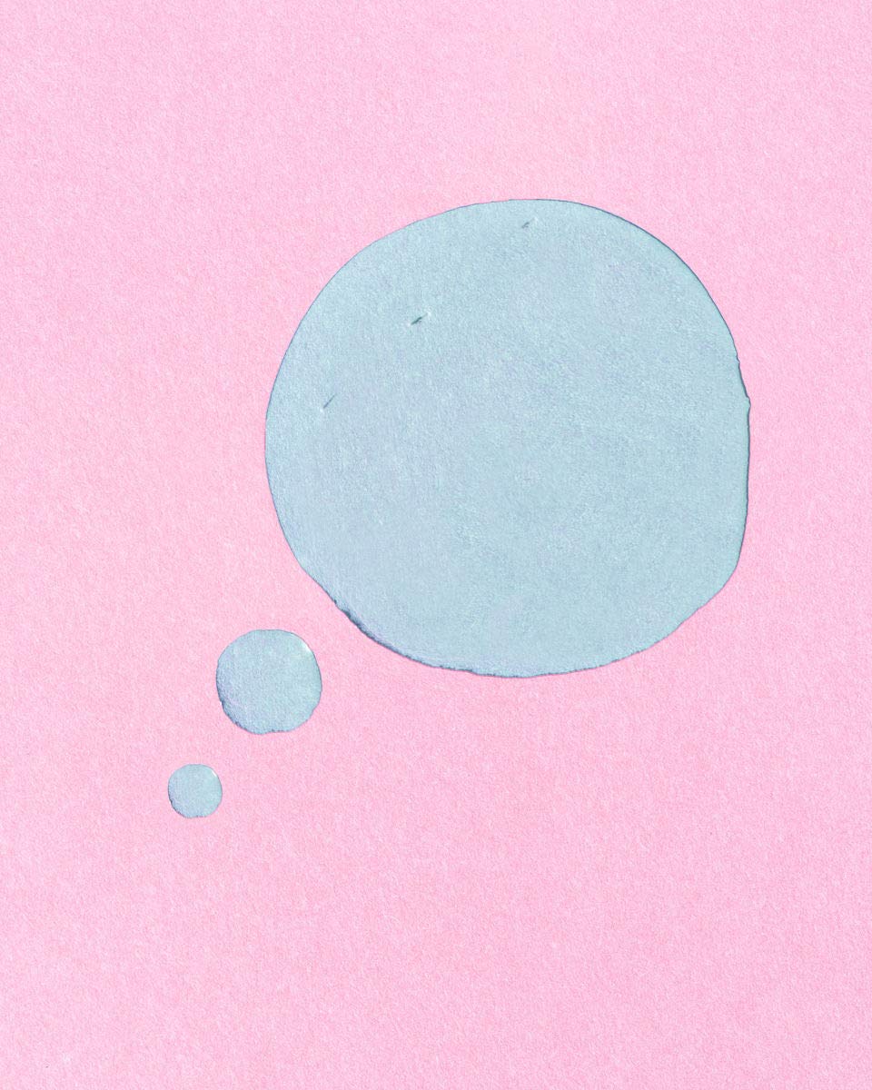 Earth Harbor pouring blue-hued MARINA serum highlighting plant-derived color