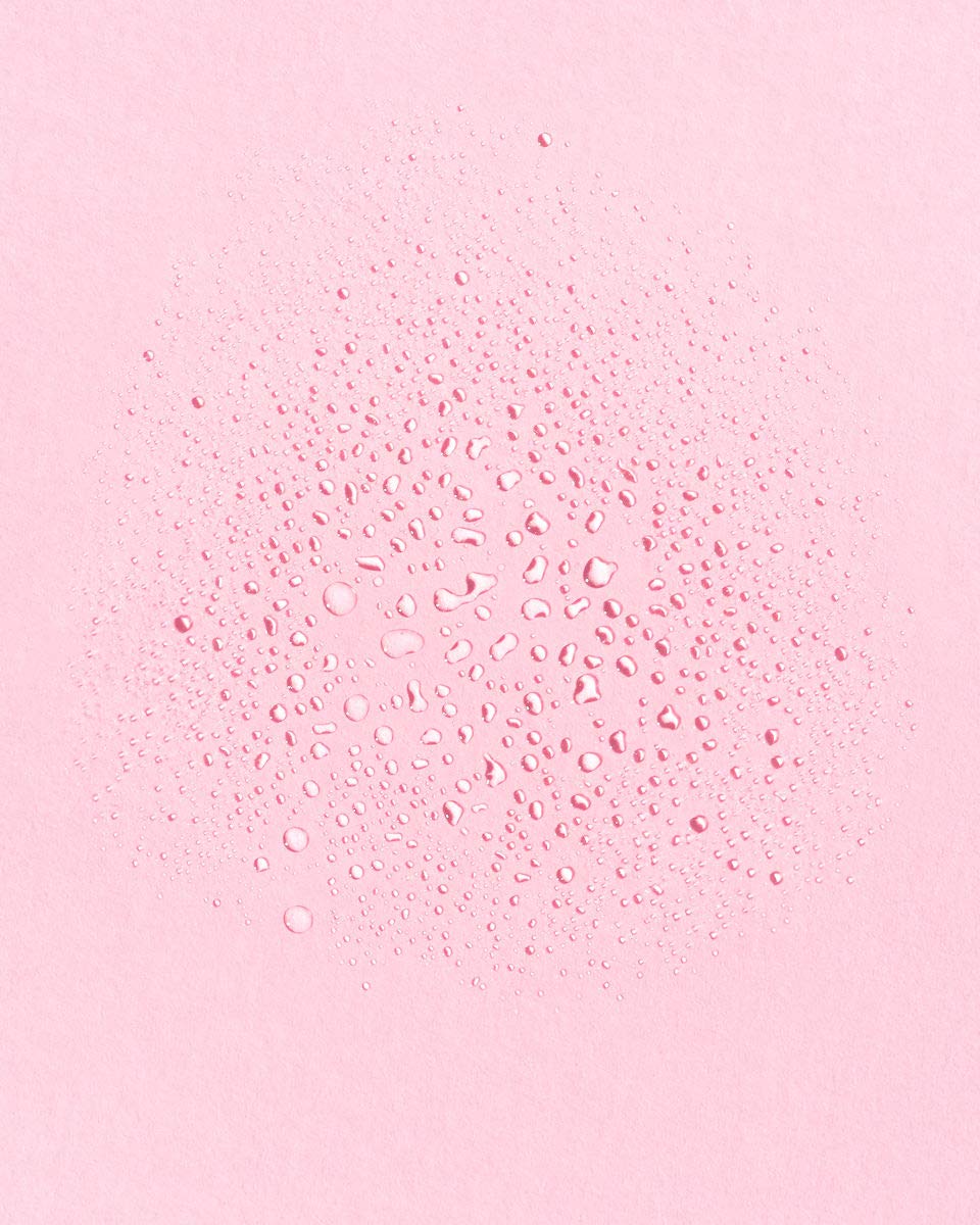 Earth Harbor toner droplet on skin texture illustrating hydration and lightweight finish