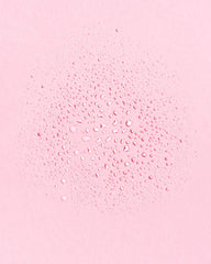 Earth Harbor toner droplet on skin texture illustrating hydration and lightweight finish