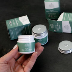 Earth Mama balm on bathroom shelf illustrating daily skincare routine