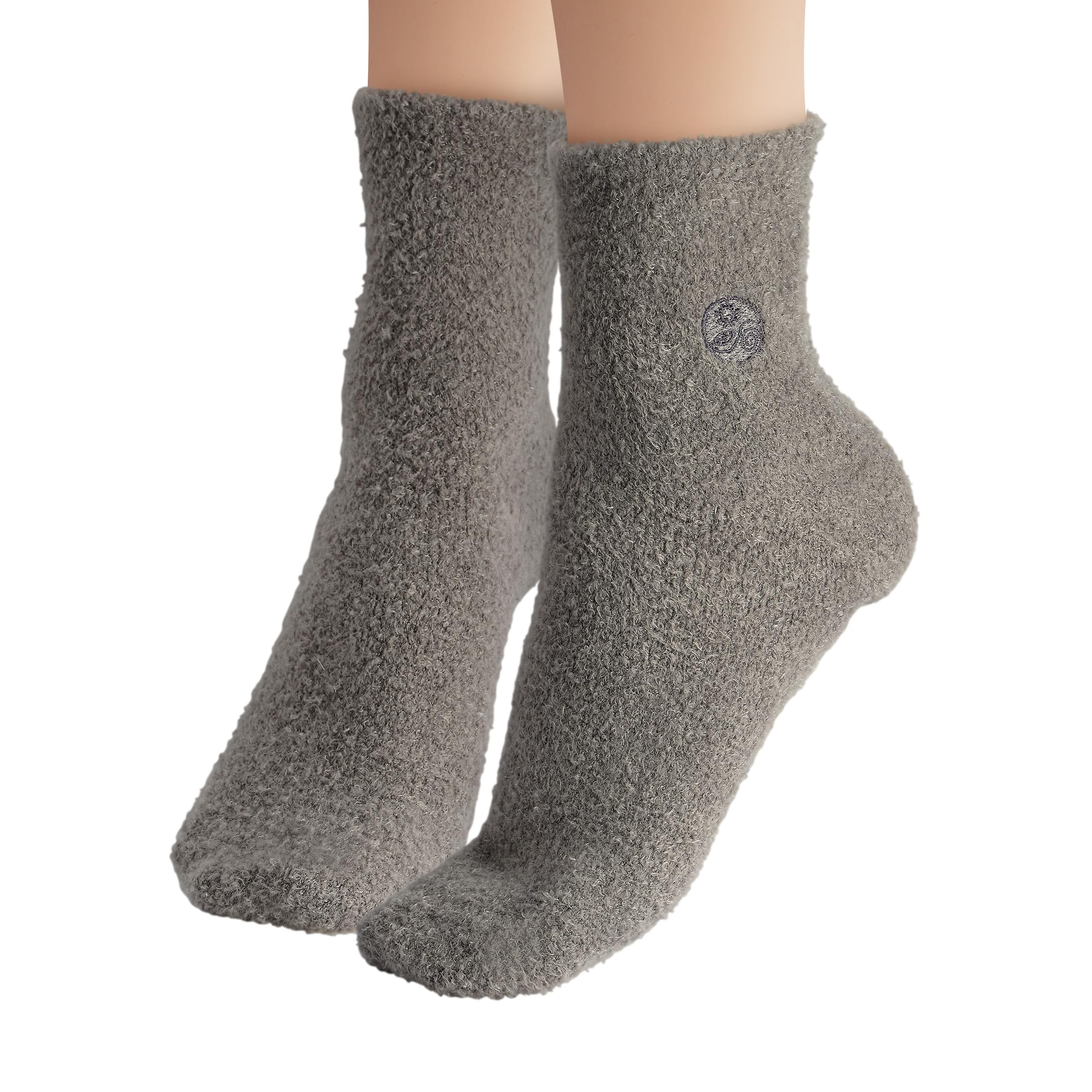 Earth Therapeutics socks next to ruler to show one-size-fit scale