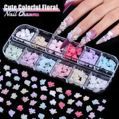 editTime six boxes opened to reveal mixed-color flower charm assortment