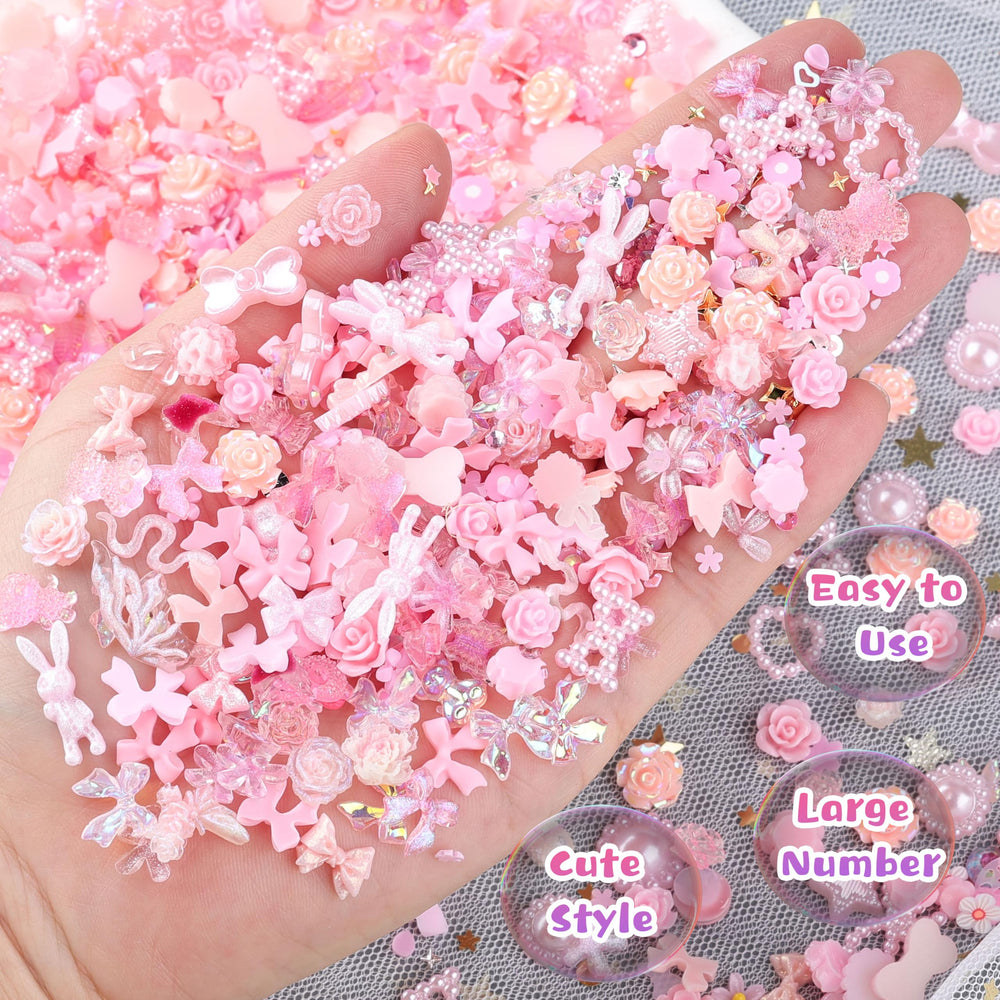 editTime finished manicure on hand showing cohesive pink design