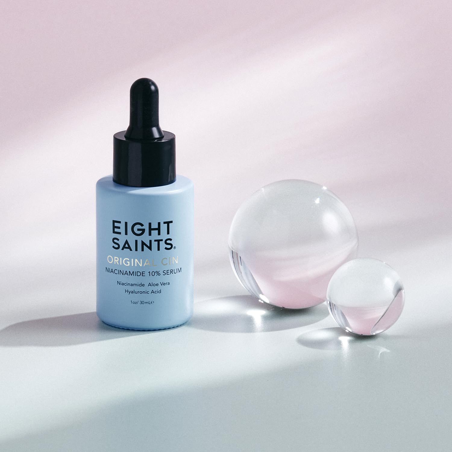 Applying Eight Saints serum to hand demonstrating quick absorption and hydration